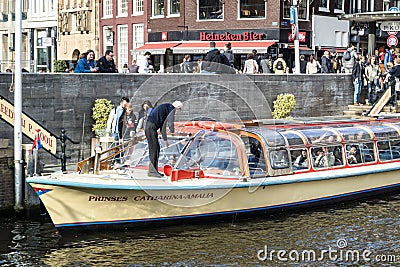 Amsterdam , Netherlands - April 31, 2017 : Captain cleaning the front windows Editorial Stock Photo