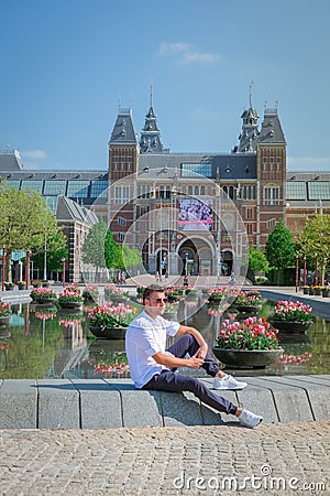 Amsterdam Netherlands April 2020, almost empty Amsterdam Rijksmuseum square during the corona covid 19 outbreak virus in Europe Editorial Stock Photo