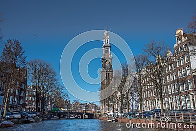 Amsterdam, Netherlands, April 2022. The Prinsengracht in Amsterdam with the Westertoren and houseboats. Editorial Stock Photo