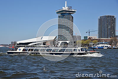 Amsterdam, Netherlands. April 2023. The river IJ with the Eye museum and a canalboat. Editorial Stock Photo