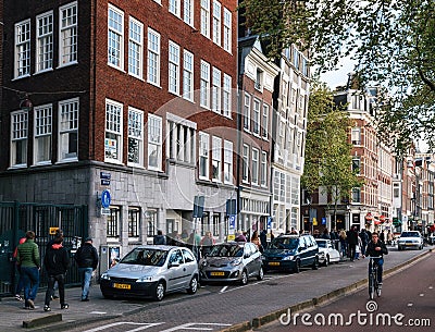 Traditional houses tilted in different directions in Amsterdam Editorial Stock Photo