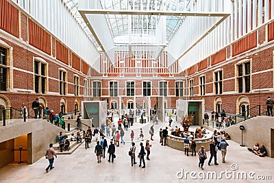 AMSTERDAM, THE NETHERLANDS - AUGUST 03, 2017: Visitors in modern main hall in the new atrium of the Rijksmuseum. Editorial Stock Photo