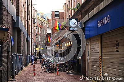 Amsterdam - 09/15/2019: Beautiful little traditional houses and a gay sauna with the LGBT symbol in Amsterdam. LGBT f Editorial Stock Photo