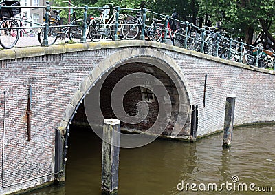 Amsterdam, The Netherlands, city canals, boats, bridges and streets. Unique beautiful and wild European city. Stock Photo