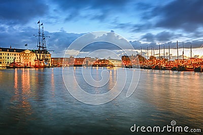 Oosterdok canal in Amsterdam with the Maritime Museum and VOC sh Editorial Stock Photo