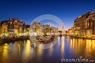 Amsterdam, Netherlands. Evening cityscape. Dark sky and city lights. Dutch canals. Stock Photo