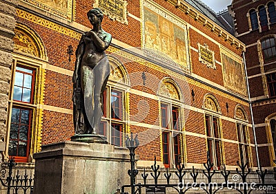 AMSTERDAM, NETHERLANDS - JANUARY 1, 2016: Ancient bronze statue in park of The Rijksmuseum. Netherlands national museum. Amsterda Editorial Stock Photo