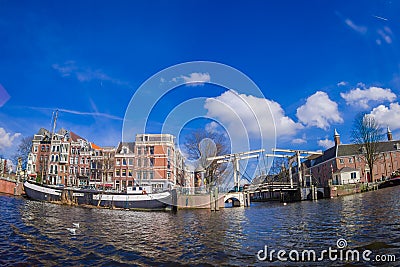 AMSTERDAM, NETHERLANDS, MARCH, 10 2018: Outdoor view of skinny Bridge Dutch: Magere Brug over the Amstel river in Editorial Stock Photo