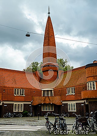 Old social homes in Amsterdam with oranges roof slates Editorial Stock Photo