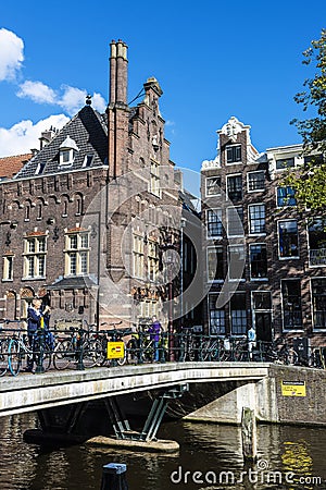 Old traditional leaning houses along the canal in Amsterdam, Netherlands Editorial Stock Photo