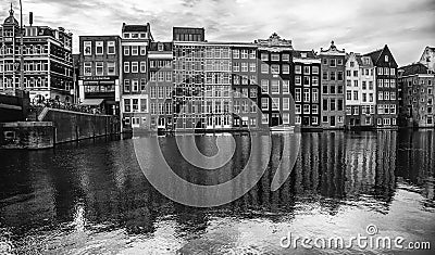 AMSTERDAM,NETHERLANDS - SEPTEMBER 06, 2018: Sunset in Amsterdam.Bicycle parking and traditional old dutch buildings.Flower market Editorial Stock Photo