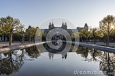 Exterior of the Rijksmuseum reflected in the water, early morning in Amsterdam, Noord-Holland, The Netherlands Stock Photo