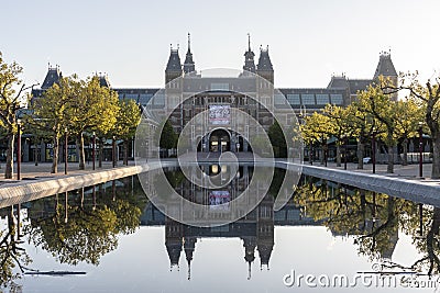 Exterior of the Rijksmuseum reflected in the water, early morning in Amsterdam, Noord-Holland, The Netherlands Stock Photo