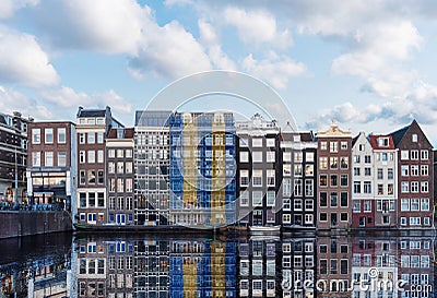 Amsterdam old buildings with canal in summer. Famous landmark and travel destination in Netherlands Stock Photo