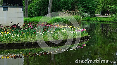 Amsterdam park with a lake, flowers grow around the gazebo Stock Photo