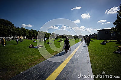 Amsterdam path bicycle lane pedestrian park water sculpture Holland river Editorial Stock Photo