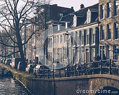 Amsterdam autumn in the morning, old city centre, bridge, canals of Amsterd Editorial Stock Photo