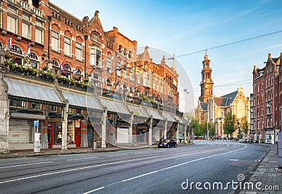 Amsterdam street with cathedral Westerker at sunrise, Netherlands Editorial Stock Photo