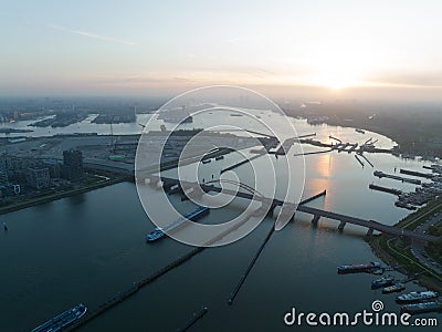 Amsterdam, 11th of may 2022, The Netherlands. Transportation ship going under a bridge and sluice waterway aerial drone Editorial Stock Photo
