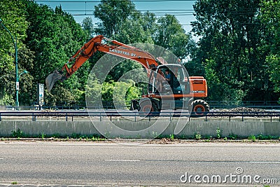 Big excavator, work on the tramway Editorial Stock Photo