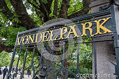 Amsterdam Vondelpark entrance gate open, gold letter text. Vondel park, Dutch garden. Netherlands Editorial Stock Photo