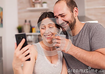 Amused couple looking at the phone Stock Photo