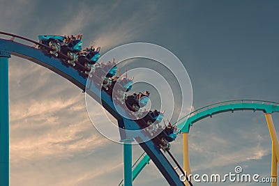 Amusement Kraken roller coaster on sunset background at Seaworld. Editorial Stock Photo