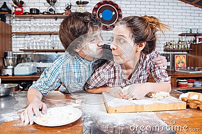 Amusing couple making funny faces on kitchen together Stock Photo