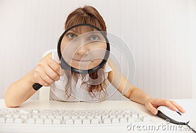 The amusing girl with the computer keyboard and a Stock Photo