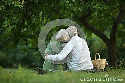 Amusing old couple in summer park Stock Photo