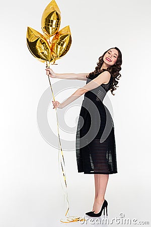 Amusing positive lovely female posing with star shaped balloons Stock Photo