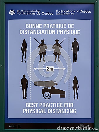 Amusing poster demonstrating how to measure a two-meter physical distancing using military symbols Editorial Stock Photo