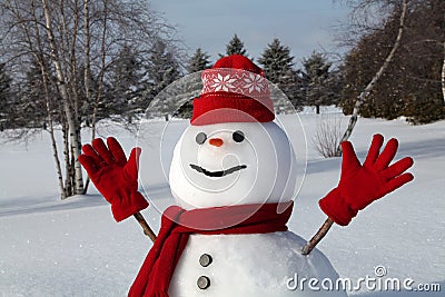 Snowman with red scarf and hat Stock Photo