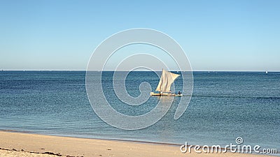 Anakao, Madagascar - May 03, 2019: Calm sea with piroga - traditional wooden fishing boat used on this African island, more boats Editorial Stock Photo