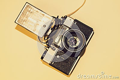 Analog camera on yellow background. copy space Stock Photo