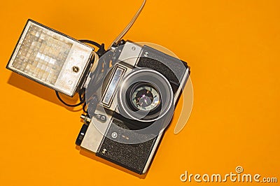 Analog camera on yellow background. copy space Stock Photo