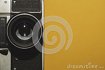 Analog camera on yellow background. copy space Stock Photo