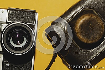 Analog camera on yellow background. copy space Stock Photo