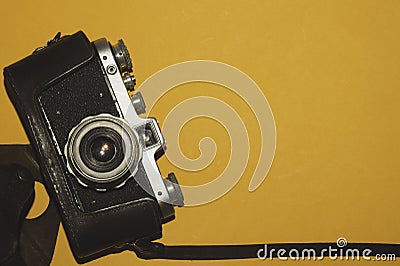 Analog camera on yellow background. copy space Stock Photo