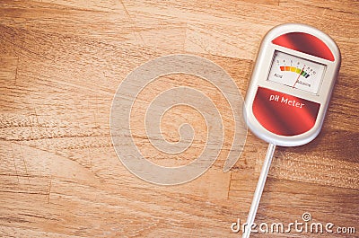 analog soil ph meter on a wood surface Stock Photo