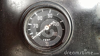 Analog speedometer display on generator engine to show temperature height Stock Photo
