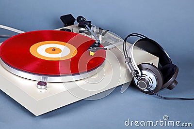 Analog Stereo Turntable Vinyl Record Player with Red Disk and He Stock Photo