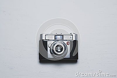 Analogic vintage Werlisa camera on a white wooden desktop. Overhead shot with flat lay photo concept and empty copy space Editorial Stock Photo