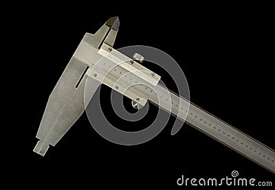 Analogue vernier calliper made of stainless steel for precise measurements, isolated on black background Stock Photo