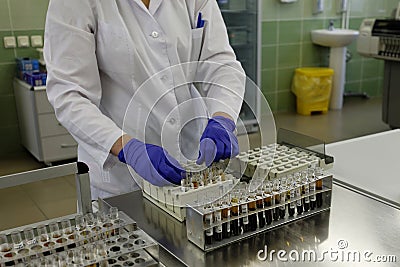 Analyst collects the blood samples Editorial Stock Photo