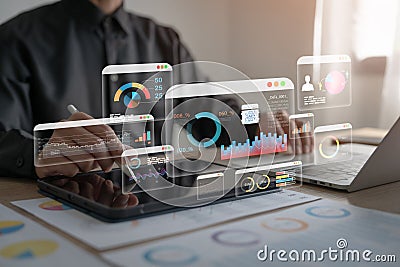 An analyst uses a computer and dashboard for data business analysis and Data Management System with KPI Stock Photo