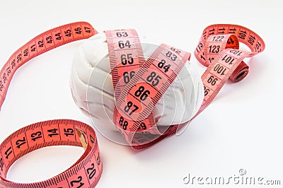 Anatomical shape of human brain wrapped measuring tape. Concept photo for visualizing measuring brain size, brain size and weight Stock Photo