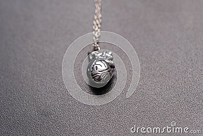 Anatomy 3D heart pendant with necklace silver color closeup. Selective Focus Stock Photo