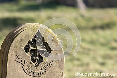 Ancestry and genealogy. Ancient gravestone inscribed with in memory of Stock Photo