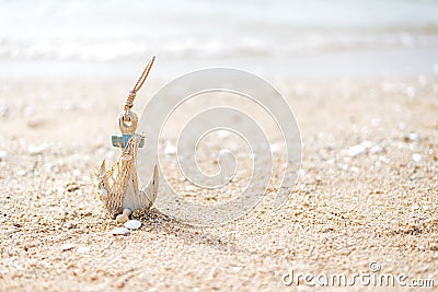 Anchor in the beach Stock Photo